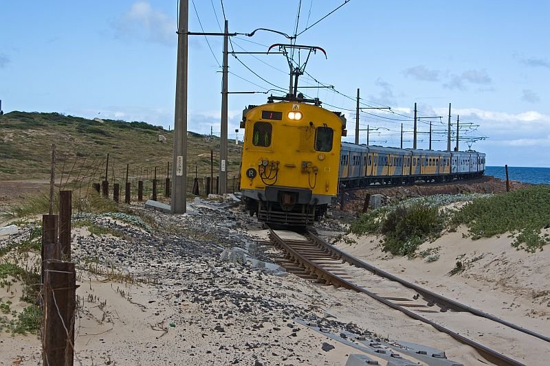 The person in the driver's cab is alertly.