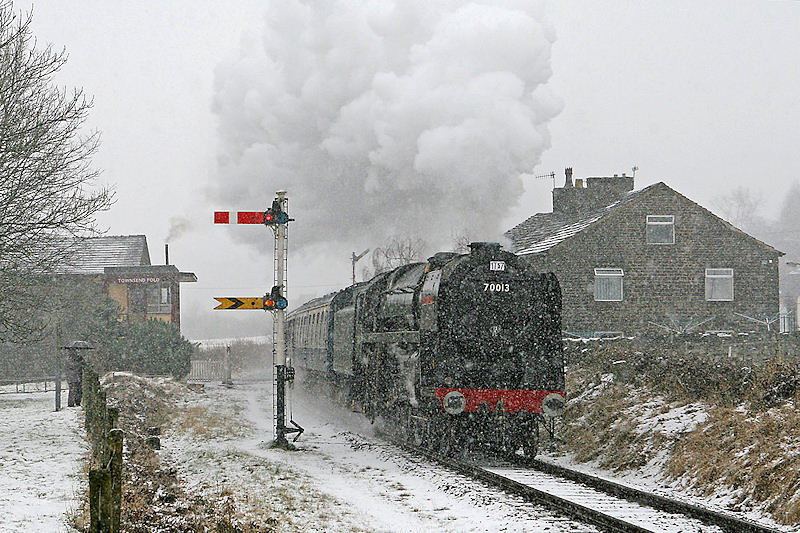 70013 is later seen in a snowstorm passing Townsend Fold with the 14.00 ex-Rawtenstal - David Rodgers