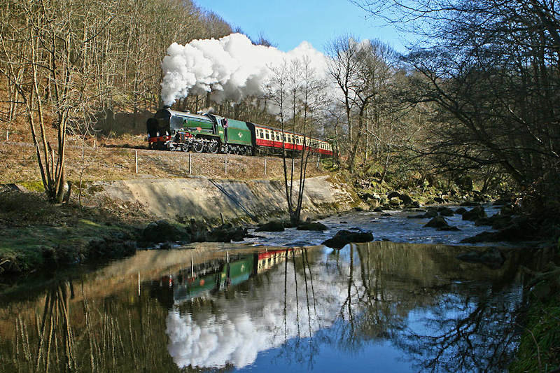 The windless conditions were ideal for a reflection in the River Esk of No. 30926 on the 11.00 ex-Whitby before Glaisdale station.<br />D Rodgers 7 March