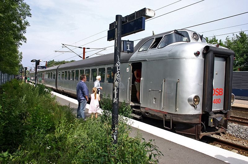 The break was used to have a view at the drivers cab. The person inside the train is waiting to have a view at it.