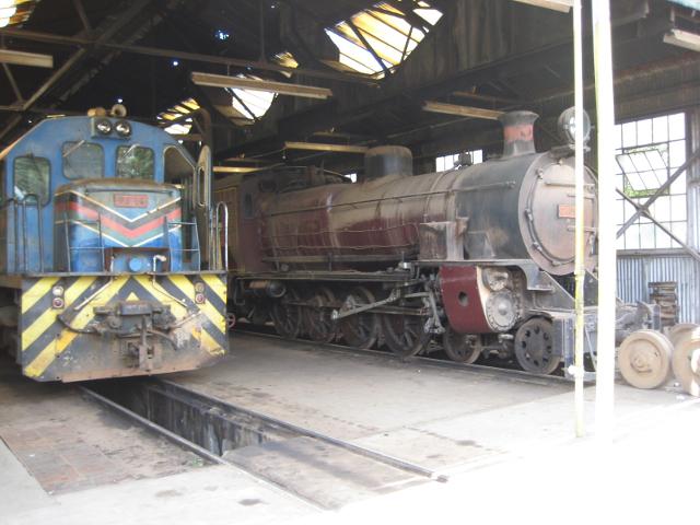 9326 runs through the steam shed, passing 2409