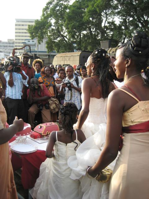 The bride and groom are about to cut the cake