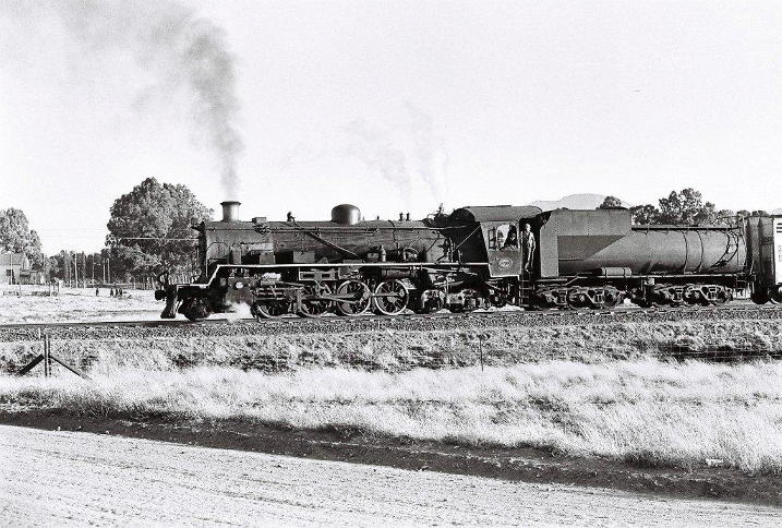 Last of the class. Number 3700, class 24, en route from its depot at Rosmead to the Lootsberg Pass as the daily pick up. At this time there were still class 19B working the line but gradually the class GMAM Garratts were taking over. 1970's