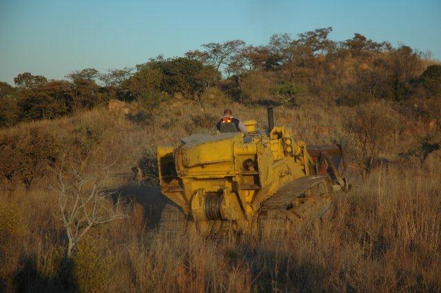 Breakdown crew bulldozer ready to haul in slings from the opposite side of the cutting