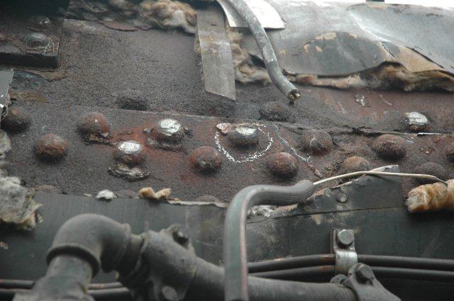 The circled rivet is suspect but the others look ok.