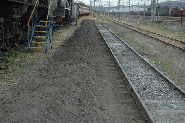 Looking Westwards, the sleepers are being exposed and the ground systematically levelled out