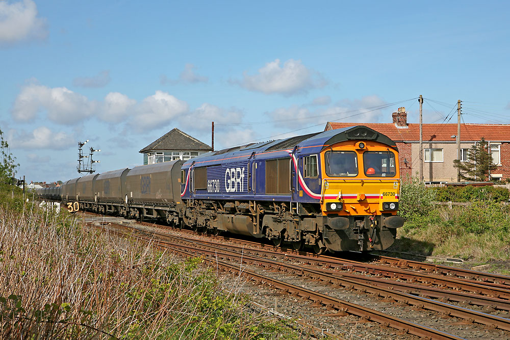 66730 heads south at Marcheys House signalbox with coal empties from Lynemouth.