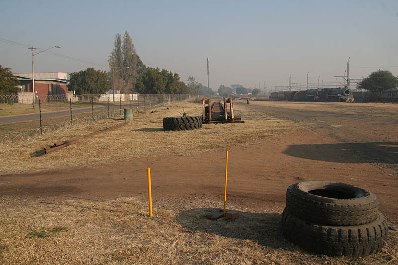 The new storage line is straight and reaches up to the entrance road. Note also electric fencing underway