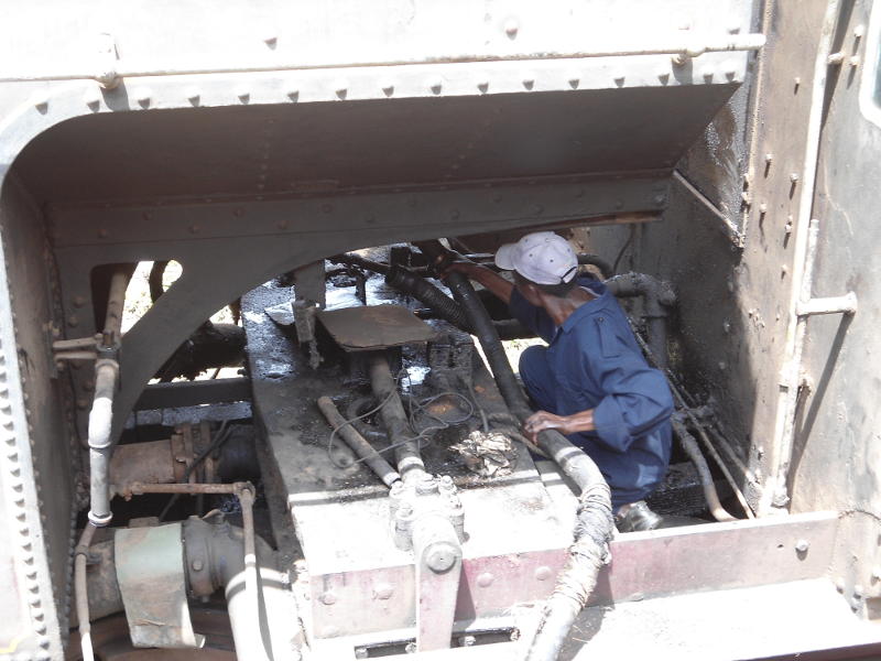 Connecting a hose to the outlet from 5918's fuel bunker