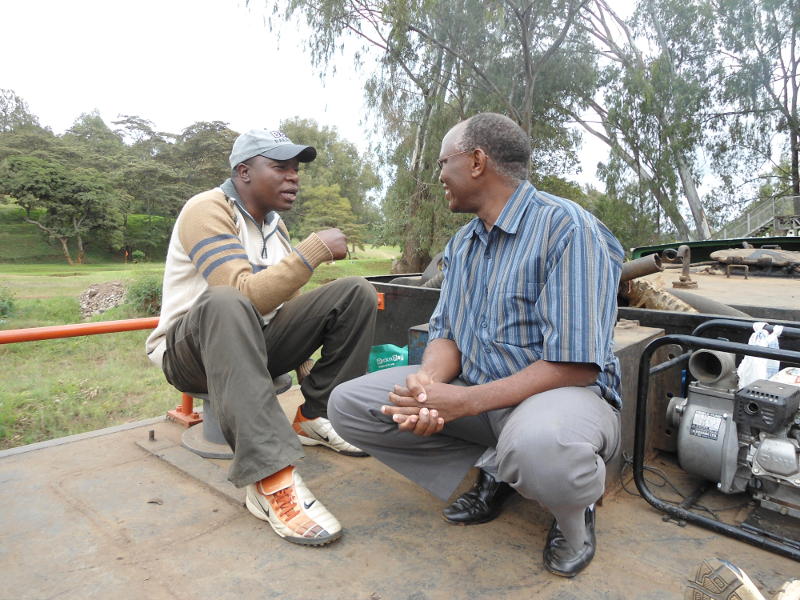 After departing from Mawenzi Gardens, Museum Curator Maurice Barasa (left) and businessman Frances Waweru discuss matters of grand strategy relating to steam operations in Kenya. They're riding "tender class", which we agreed comes above 1st class (except when it rains...)