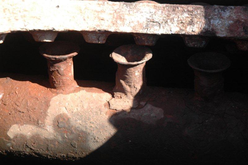 Lets look in the boiler.<br /><br />The  locomotive raises steam by the boiling of water. The steam will then rise, and on a conventional "domed" boiler, the steam will be collected there and taken to the superheater header where it is reheated to eliminate all the water content, before being sent to the steam chest. Large locomotives such as the 15F, 25 class, had bigger boilers and thus no room for a dome, so a number of  "collector" pipes are fitted into the boiler at the highest internal point, to perform the work of the "dome".<br /><br />A few class 19D were built with "domeless" boilers, and 2650 is one of them. Here we can see the collector pipes looking like rows of small trumpets.