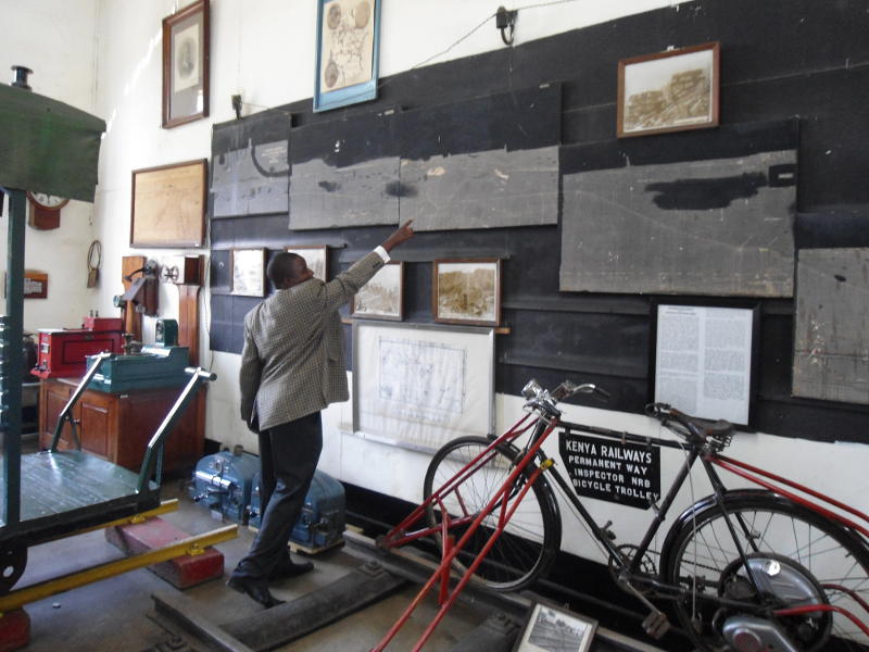 Museum Curator Maurice Barasa illustrates a point as we discuss how to dismantle and move the large elevation map on the end wall of the museum