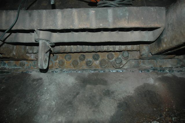 The metal strip to prevent any live coals from accidently exiting the firebox, has been welded in place by John Dadford. The ashpan has been checked for such possible danger areas and closed up. Viewed here in 15F 3117's firebox looking up from under the grates.