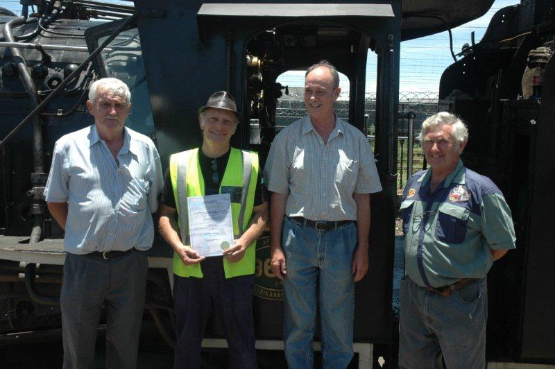 Cliff Avis on the left, the rules and regulations instructor, Nathan the new steam train driver, Michile Boshoff, lecturer Locomotive, and Coen Pretorius, the driver instructor.