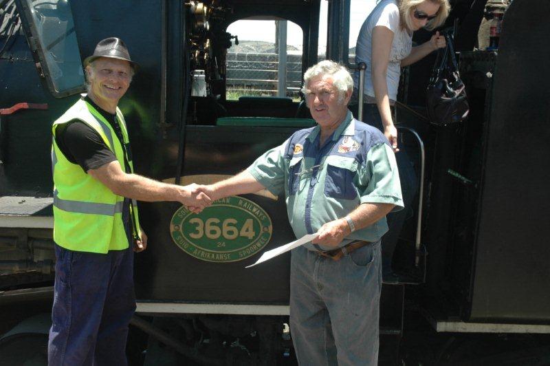 Childhood dream come true at last. Nathan gets his steam train driver's certificate from Mr. Coen Pretorius, the instructor