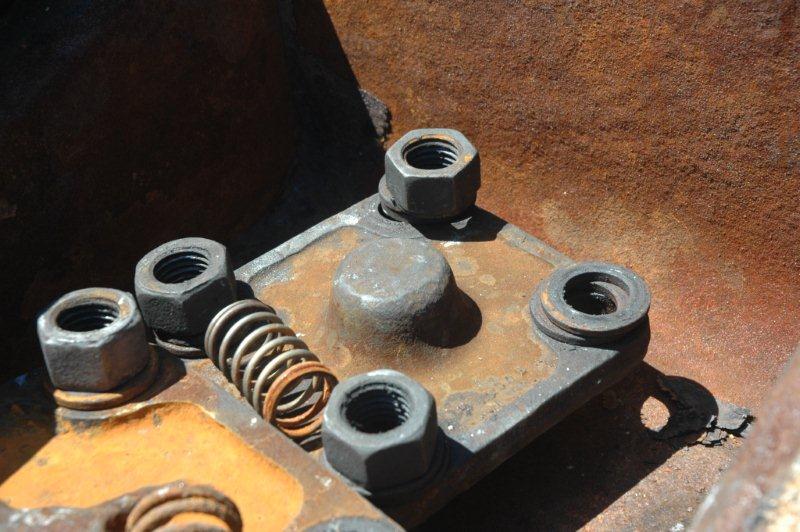 The regulator valve cover plus it's spring.