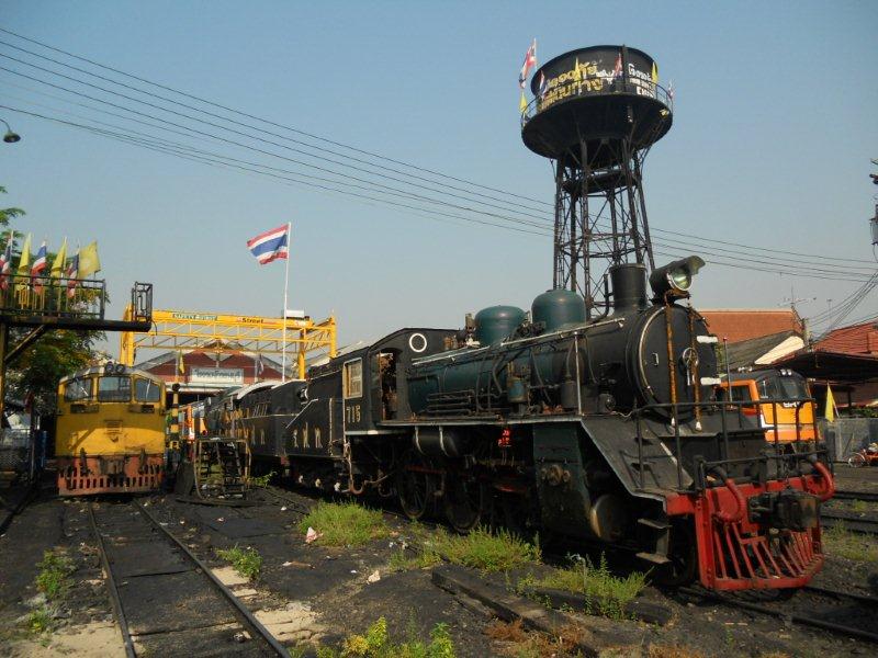 Thonburri depot in Bangkok. Two wood burning locomotives that are used on the River Kwaai festival trip in November stand out of service in the depot front area.