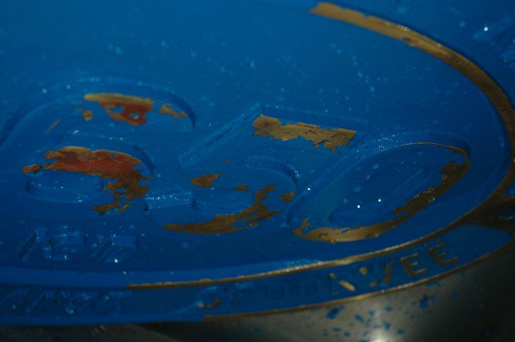 The brass lettering now appears after slowly being removed with my finger nail and water!!