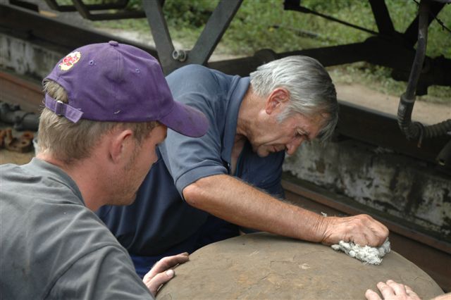 Dewald and Uncle John square up the vacuum cylinder cover before fitting. <br /><br />Photo Nathan Berelowitz 09/02/08