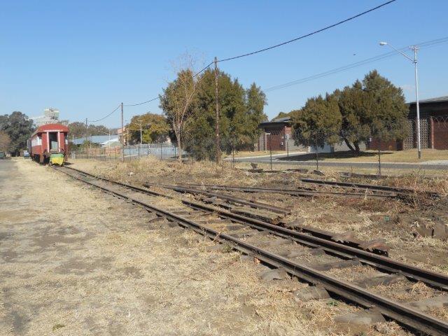 Here we see a portion of the track waiting to be removed by use of a TLB machine and "Pekenese " overseeing the operation.
