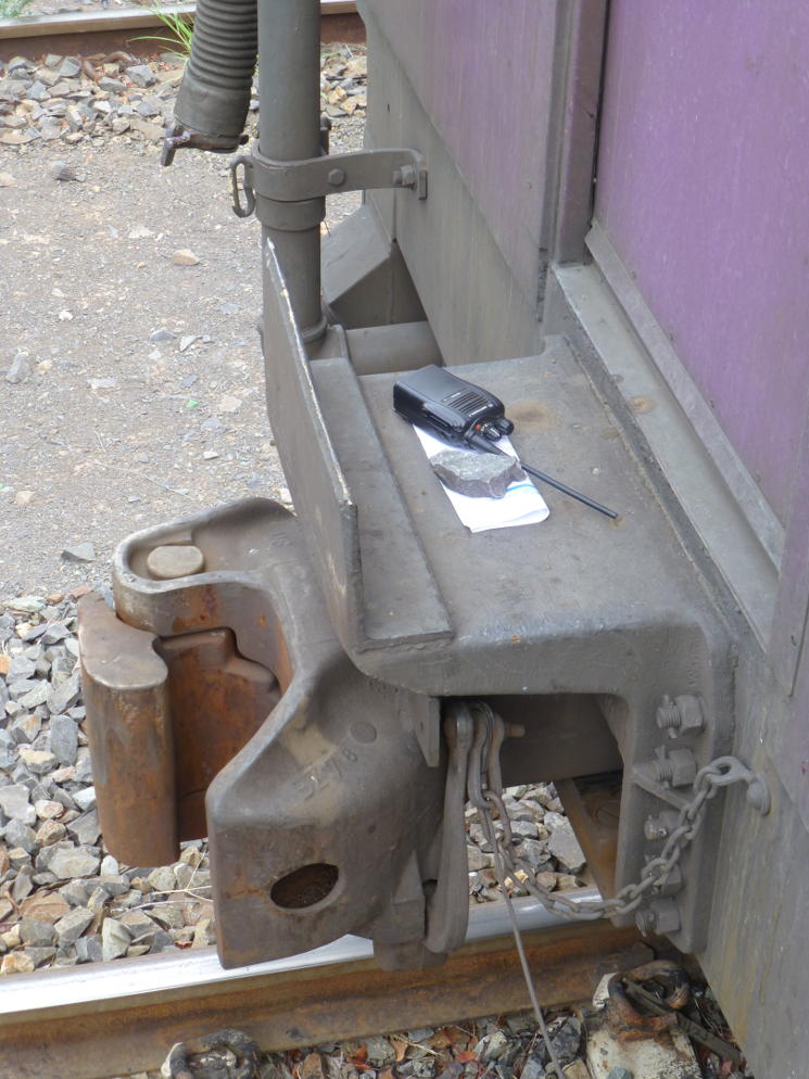 The departing Train Assistant has left the radio and the train documents, weighted down with a piece of ballast, for the new Train Assistant.