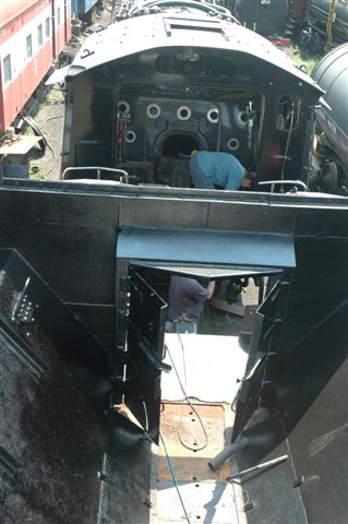 Soon to be united. The view from the tender of 15F 3117 sees some of the modifications that have been done. In the  ab, Steve Smith and Miemie are busy with new floor boarding.