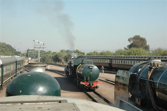 From the cab roof of 439 the class 6, we see a busy scene at the Rovos site, as 19D 2702 runs forward to couple onto the 25NC alongside the 6. This was part of a Steam Safari operation.