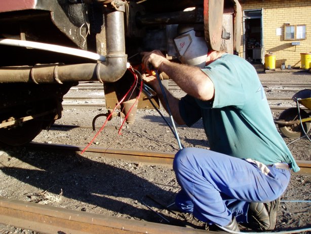 Steve welding one end of the coach<br /><br />Photo by John Ashworth 18/08/07