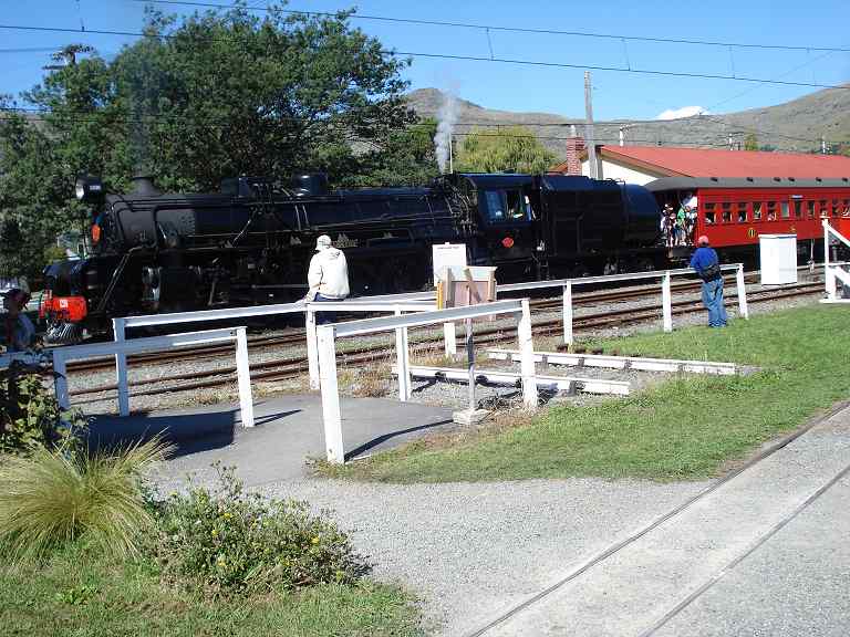 1236 awaits the signal to depart. The carriages are full to overflowing.