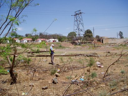 Cliff A takes notes as we search amongst the scrap at Salvokop, behind Pretoria Station<br /><br />Photo by John Ashworth 05/10/06