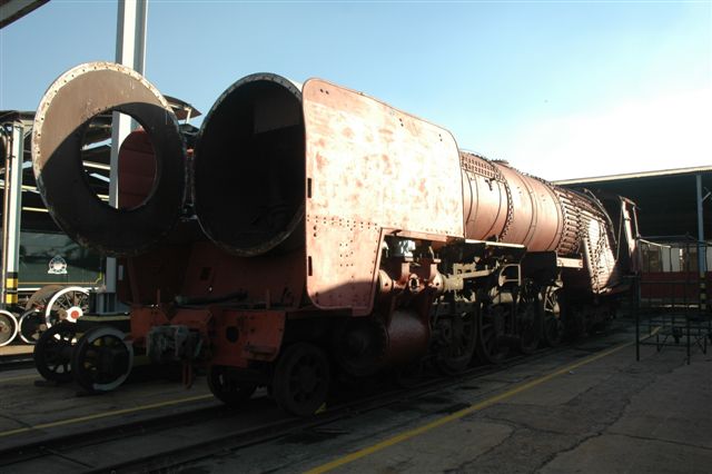 Stripped and descaled and primed. The bare body of 25NC 3480 stands at the new loco depot area of Rovos Rail. This was the original 15M shop with wheel drop etc, in steam days