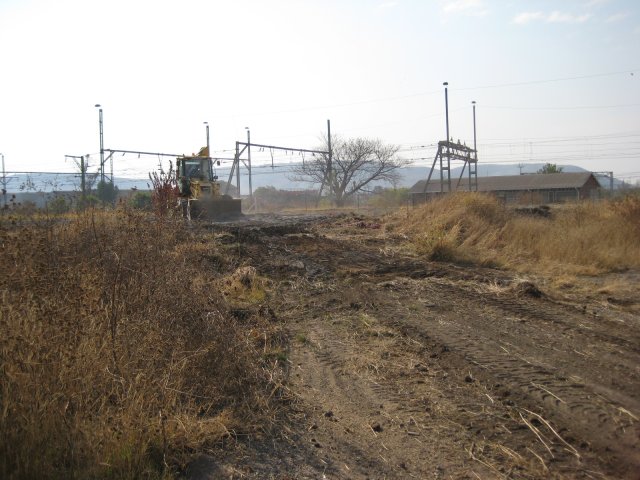 Cutting a road from the gate up to the future passenger car parking area