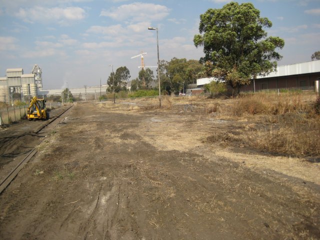 Clear at last! A view from near the office, looking eastwards across the platform and the adjacent car parking area, now cleared of bush and scrub<br /><br />Photo by John Ashworth 4th July 2008
