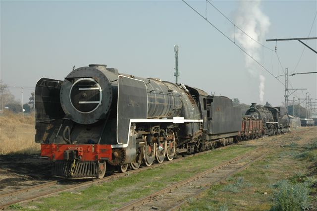 Ready for Retirement. A sad looking 3094 class 15F is propelled to her new retirement home at Hercules new site, by her long time friend "JoAnna", the class 24. This is part of the FOTR relocation from Capital Park to this site.