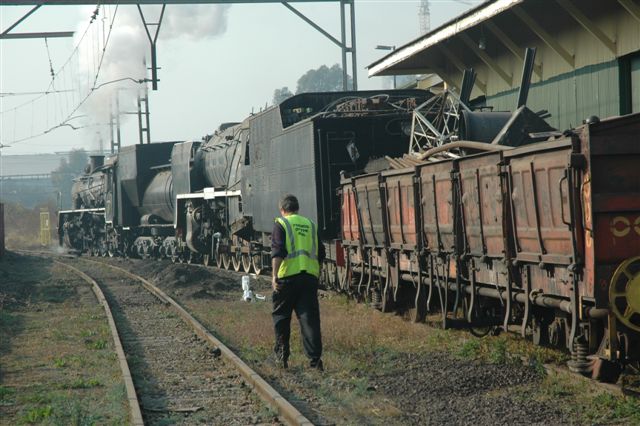 Shunter Steve Smith about to start the morning's shuntwork. The class 24 has just pushed back into the new FOTR site at Hercules, and part of the day's work was to place the DZ wagon for off loading, and to relocate the withdrawn 15F locomotive 3094 from Capital Park. Later that day, the 24 will work the first new site departure of the monthly Tshwane Explorer