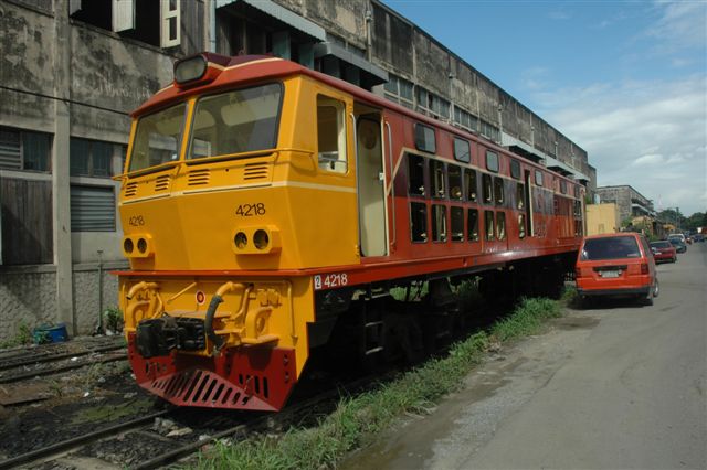 Freshly painted and awaiting motors, this diesel locomotive is awaiting its turn for the traverser to place her in one of the work bays at Bangkok's Makassan workshops
