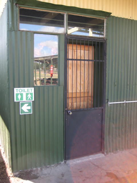 Not open yet. The fire extinguisher on the platform is reflected in the window<br /><br />Photo by John