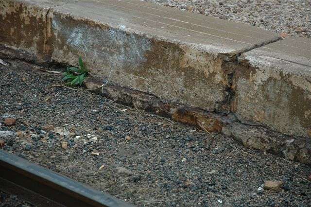 The original platform level built over 100 years ago can easily be identified here. The current platform, to raise its height, was simply cast over the original stonework. In Eric Samuel's booklet on Cullinan, you can see a photo of a locomotive standing with a train at the original level