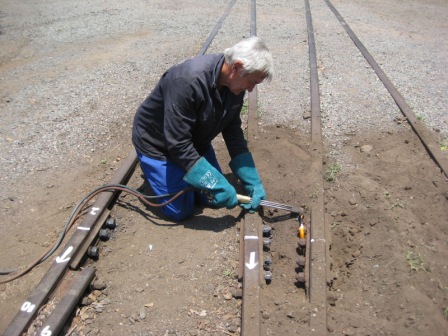 Uncle John cutting off some rusted bolts
