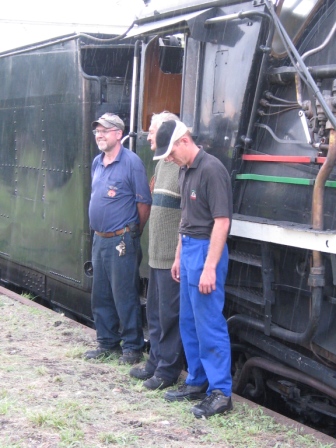Still looking bored - "When are they going to give us our new hats and let us go?"