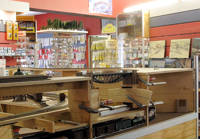 Picture 5 -Around the corner, "over a river" and down over the yard. Notice here that the bridge is already in place - scenery will be built around it.      N Mollison