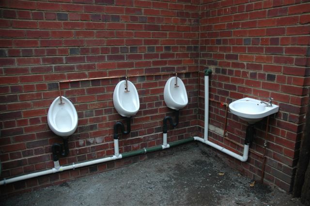 The "Le P P". Newly installed gents  with lowered trough for junior! Structure will eventually be roofed over, but this will take the strain off the current toilets.
