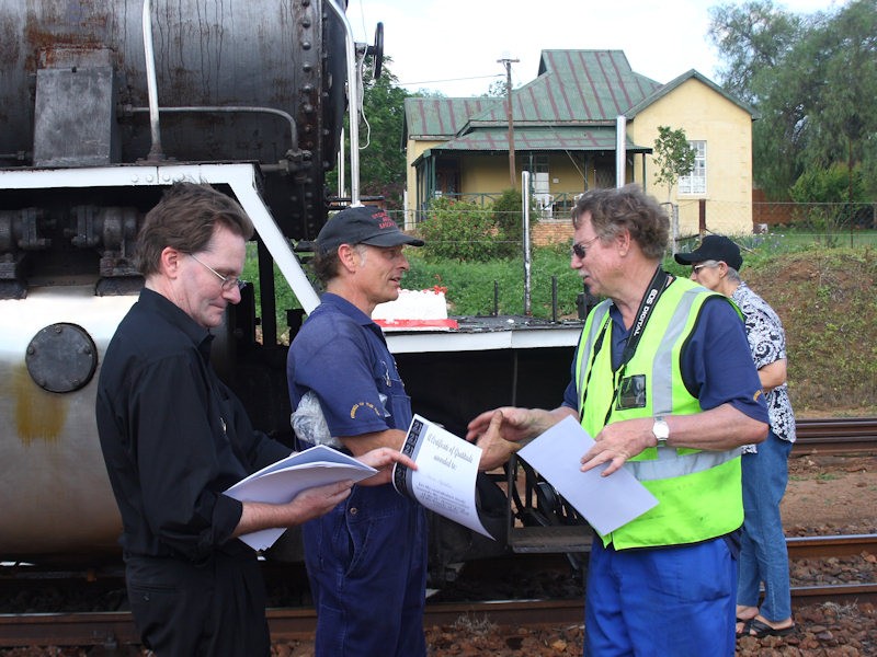 Courtney counts the remaining certificates while Nathan and Chris Koch begin an arm wrestling contest.<br />By Kevin Wilson-Smith.