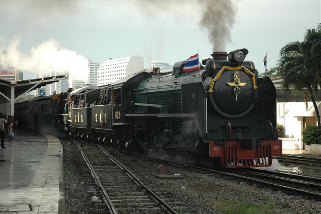 Pacific double header beats the sun as they depart Bangkok for Ayutthya on one of the few regular excursion trains run by State Railways Thailand.<br />October 23rd 2009