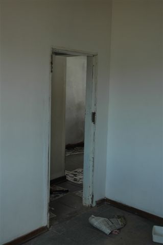 The new door frame fitted and waiting for B.Z to finish painting the wooden door. The whole building interior is undergoing a makeover, so that we can move office into the main building