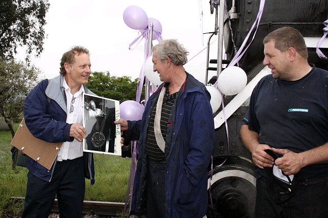 Nathan looks as if he is selling dirty postcards to Cliff and Gabor