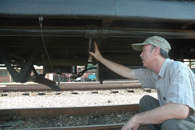 Lecturer Mr. Michiel Boshoff points out the branch pipe from the main train pipe to the vacuum cylinder, during the lectures to the drivers, currently doing the book on vacuum