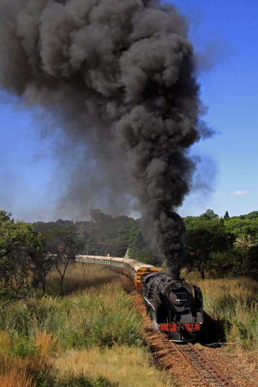 A still afternoon and liberal use of the stoker-smoke towers triumphantly into the Cullinan sky