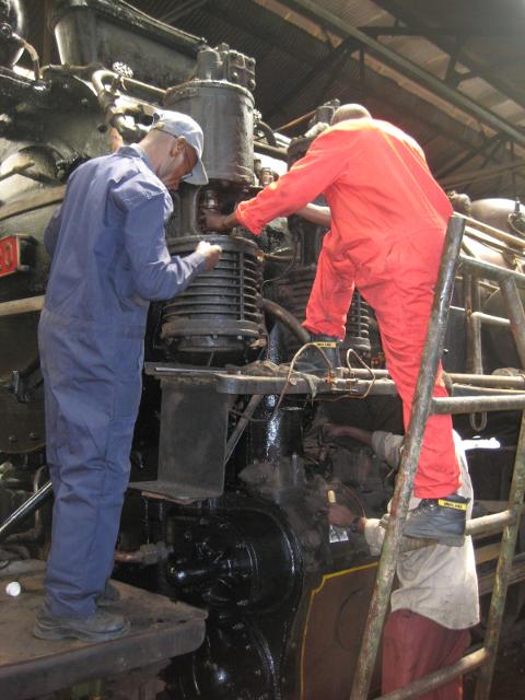 Split-level working - the air pump is serviced while painting continues down below