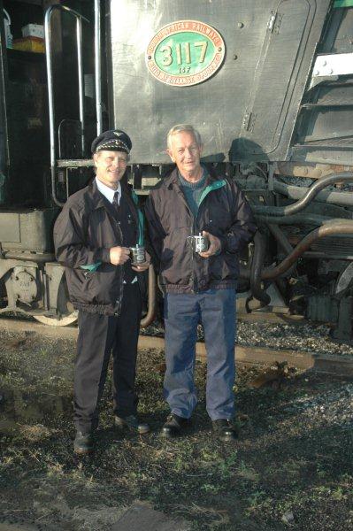 Swedish conductor uniform and stainless steel mugs, all courtesy of member Goran Enqvist, our Swedish train driver. Given as gifts to Cliff Petzer and Nathan Berelowitz, seen here alongside 15F 3117 at Hermanstad